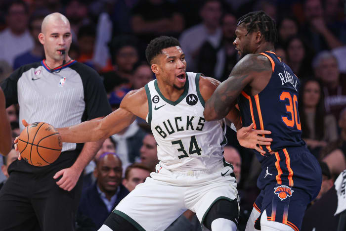 Milwaukee Bucks star Giannis Antetokounmpo defended by New York Knicks forward Julius Randle